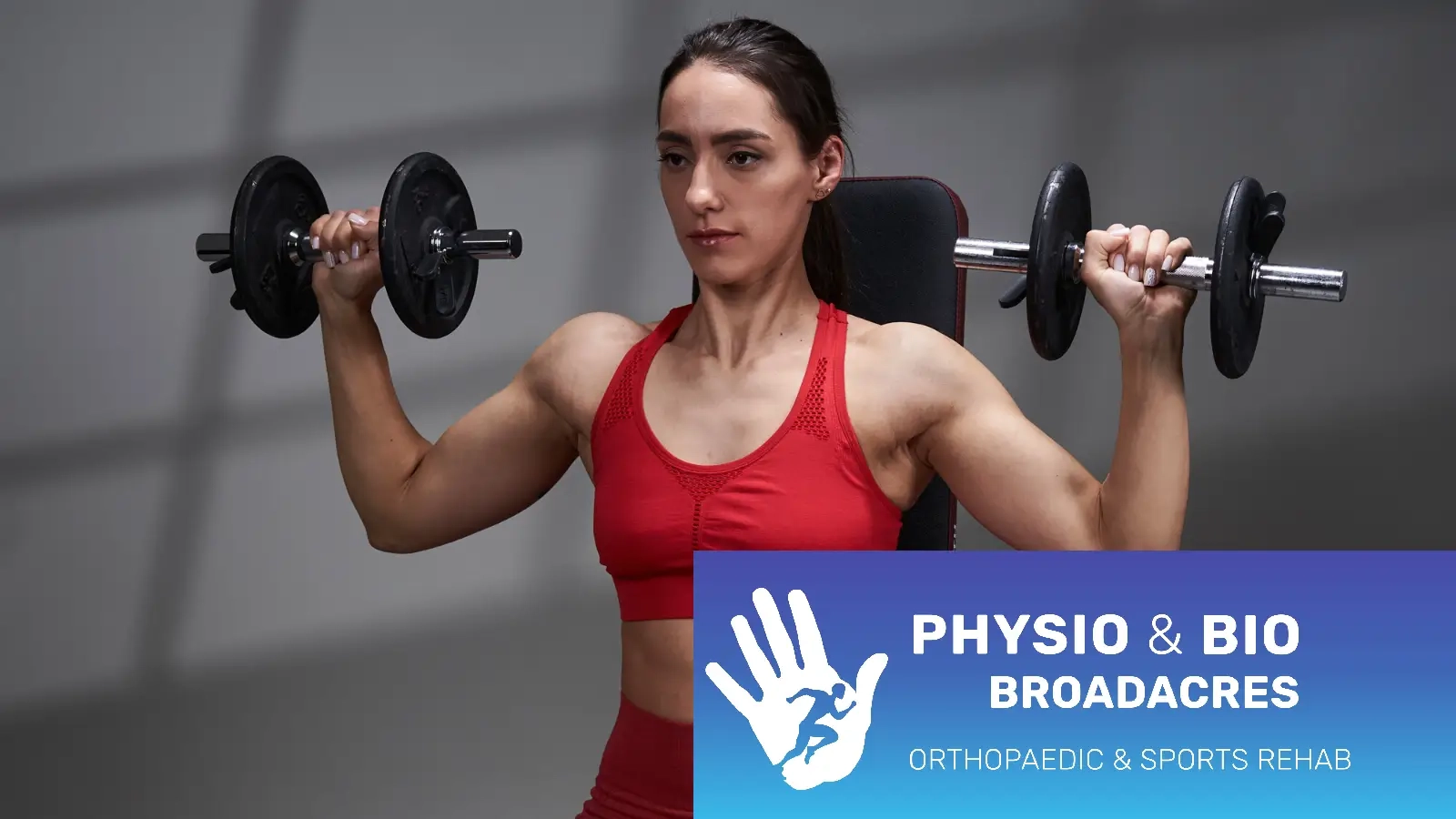 Barbend-Featured-Image-1600x900-A-person-ready-to-perform-the-dumbbell-shoulder-press