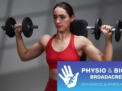 Barbend-Featured-Image-1600x900-A-person-ready-to-perform-the-dumbbell-shoulder-press